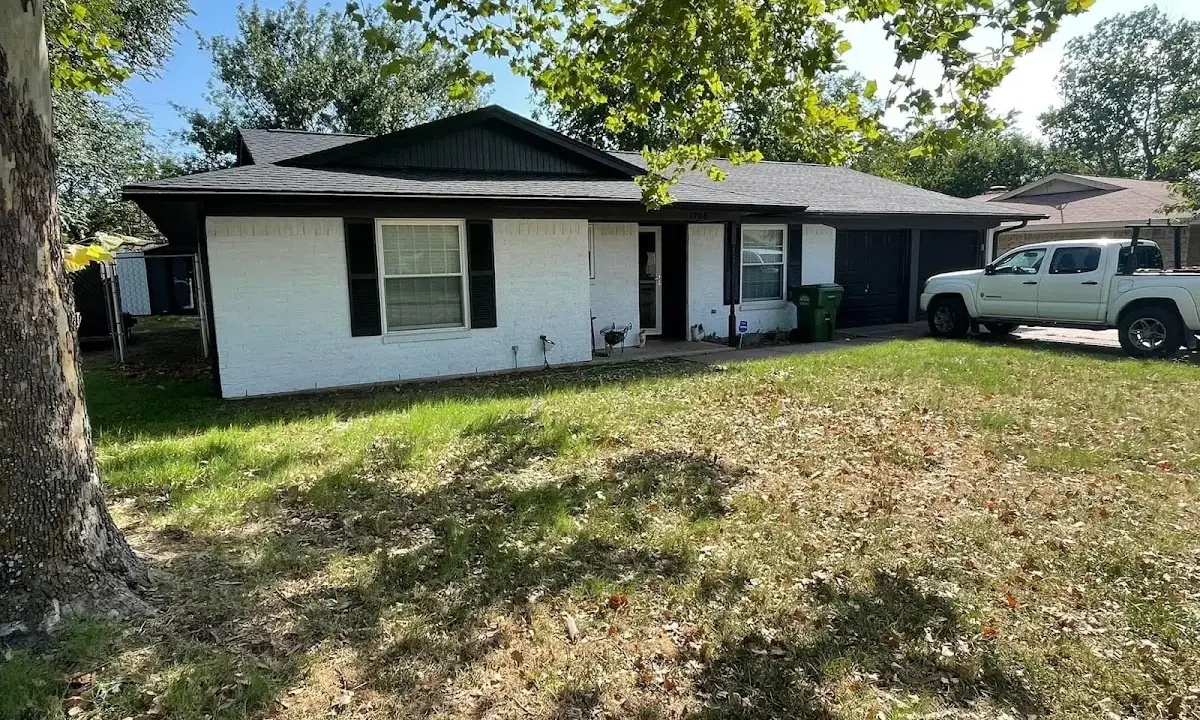 Professional roofing crew working on a residential roof in Irmo